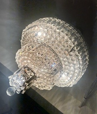 Lot 1812 - A modern chandelier suspending numerous glass...