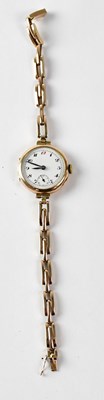 Lot 1216 - A 9ct gold ladies' wristwatch, the circular...