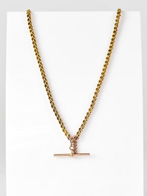 Lot 1175 - A yellow metal double link watch chain set...
