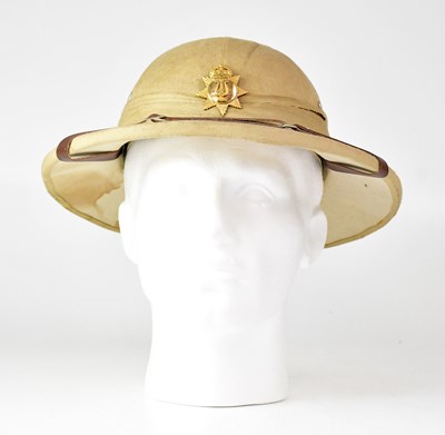 Lot 452 - A WWI pith helmet with Army Bandsman cap badge...