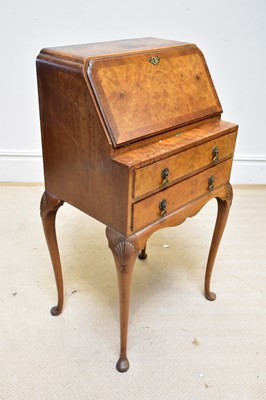 Lot 1328 - A 1950s lady's walnut bureau with fall front...