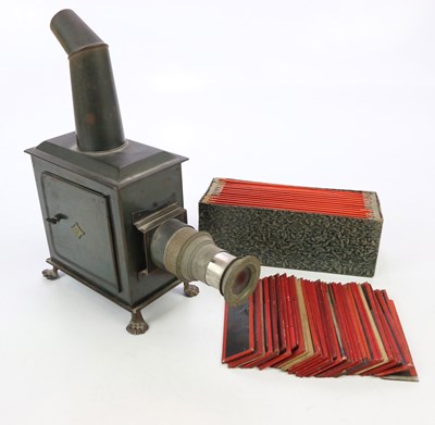 Lot 1765 - BING; a vintage metal magic lantern and...
