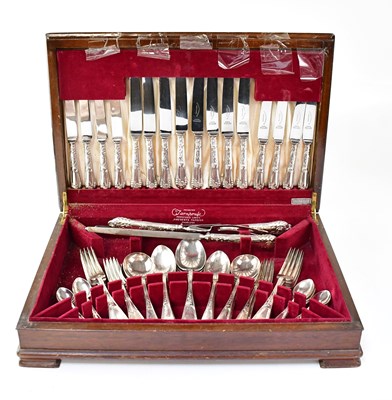 Lot 921 - A walnut cased six-setting canteen of silver...