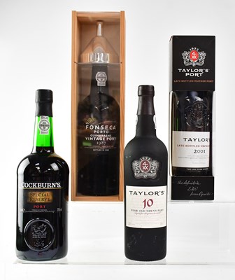 Lot 143 - Four bottles of Port comprising a boxed...