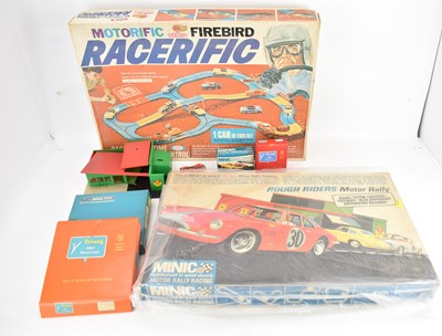 Lot 675 - Boxed racing car games comprising Ideal...