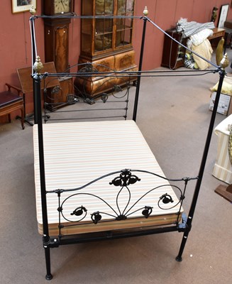 Lot 1698 - A black painted cast metal four poster bedstead.