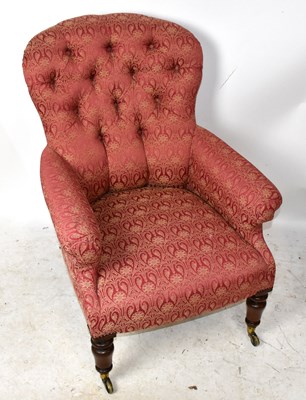 Lot 1658 - A Victorian armchair upholstered with button...