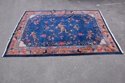 Lot 1474 - A 1920s Chinese carpet on navy blue ground...