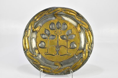 Lot 2093 - An Arts & Crafts pewter wall charger with...