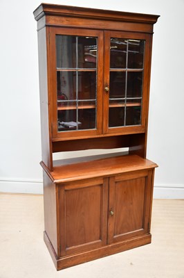 Lot 1217 - An Edwardian walnut bookcase, with two glazed...