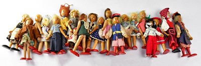 Lot 720 - A quantity of vintage wooden peg dolls in...