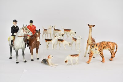 Lot 156 - BESWICK; hunter and huntress on horses,...