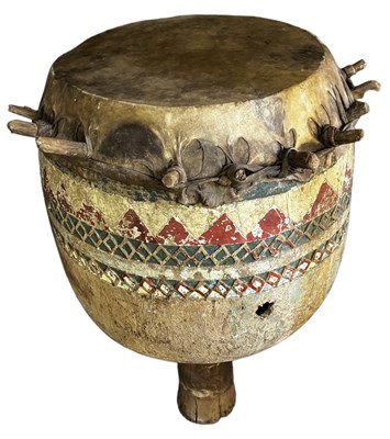 Lot 1049 - A large African goblet drum with carved and...