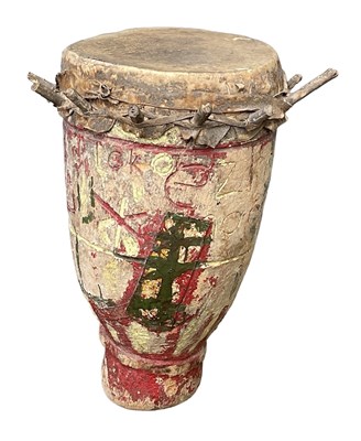 Lot 1055 - An African wooden drum with carved and painted...