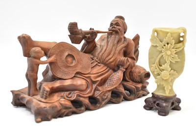 Lot 488 - An early 20th century carved wooden figure of...