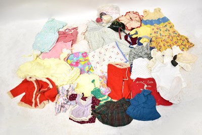 Lot 711 - A quantity of various vintage dolls' clothes,...