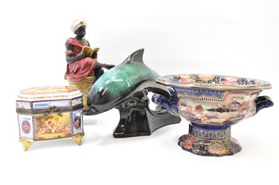 Lot 340 - A modern resin figure of an African gentleman...