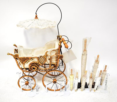 Lot 713 - A vintage Victorian-style wicker dolls' pram...