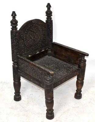 Lot 1497 - A carved and stained wood Anglo-Indian elbow...