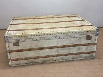 Lot 44 - An early 20th century vellum trunk, beech...