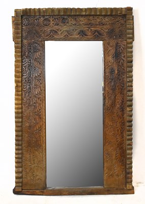 Lot 1454 - A large Anglo-Indian carved wood mirror, with...