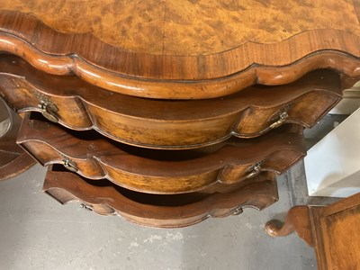 Lot 66 - A 1930s walnut three drawer bedside table on...