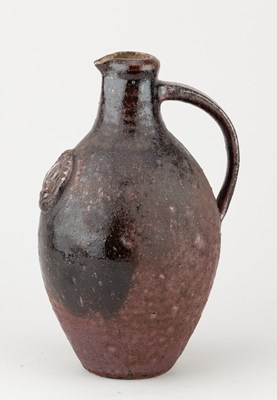 Lot 688 - A stoneware flagon with applied medallion...
