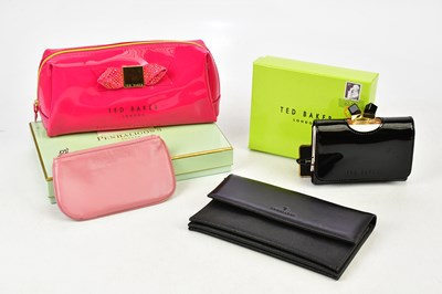 Lot 831 - TED BAKER; an unused black and pink leather...