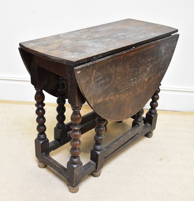 Lot 1318 - An 18th century and later oak gateleg...