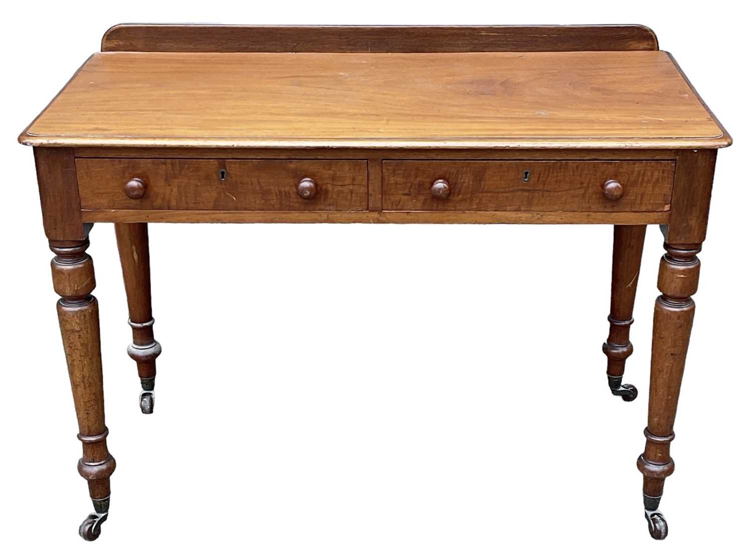 Lot 38 - A Victorian mahogany two drawer writing table,...