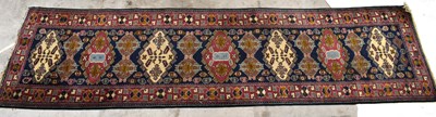 Lot 1435 - A Persian designed runner with central blue...