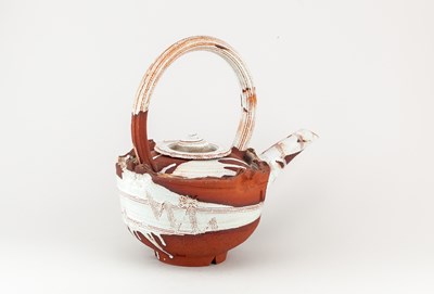 Lot 5 - ADAM TOBIN; a large red stoneware teapot...