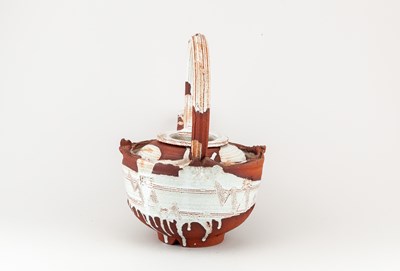 Lot 5 - ADAM TOBIN; a large red stoneware teapot...