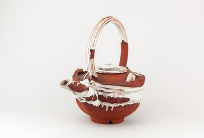 Lot 5 - ADAM TOBIN; a large red stoneware teapot...