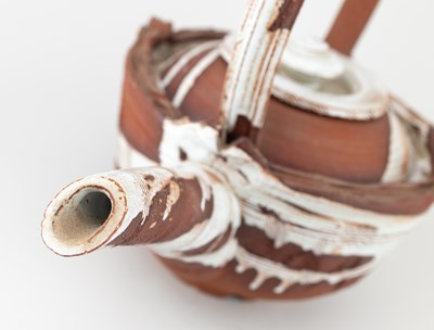 Lot 5 - ADAM TOBIN; a large red stoneware teapot...