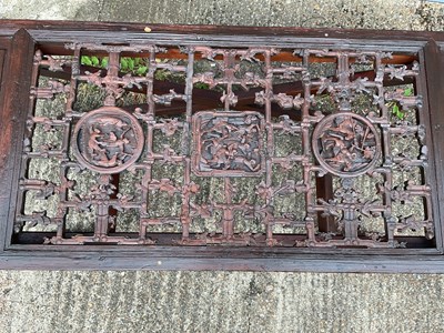 Lot 8 - A heavily carved Chinese panel, mounted on a...