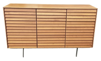 Lot 9 - PUNT MOBLES; a mid century light oak veneered...