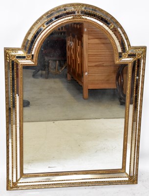 Lot 1463 - A modern giltwood and gesso arched mirror,...