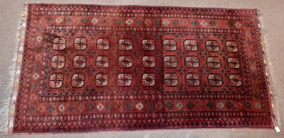 Lot 1436 - A Bokhara wool carpet, worked with geometric...