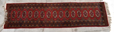 Lot 1432 - A Bokhara type wool runner, worked with...