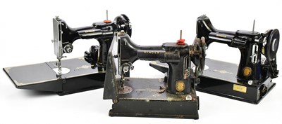 Lot 1669 - SINGER; three 20th century cast iron sewing...