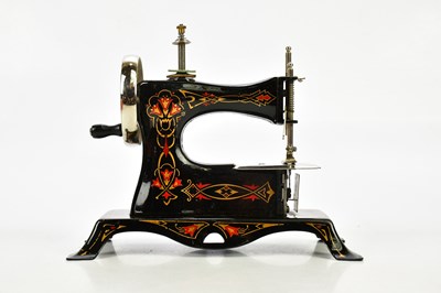 Lot 1671 - A vintage German cast metal child’s sewing...