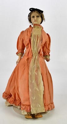 Lot 18 - An antique wax headed doll with glass eyes and...