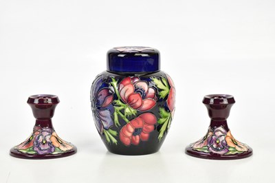 Lot 2321 - MOORCROFT; a ginger jar and cover decorated in...