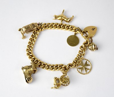 Lot 788 - An 18ct curb link charm bracelet