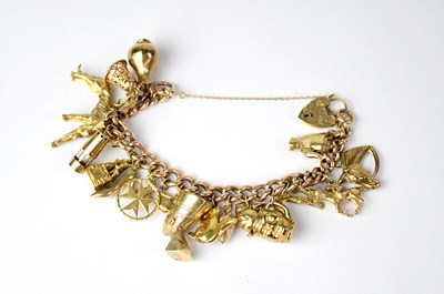 Lot 784 - A 9ct curb link charm bracelet