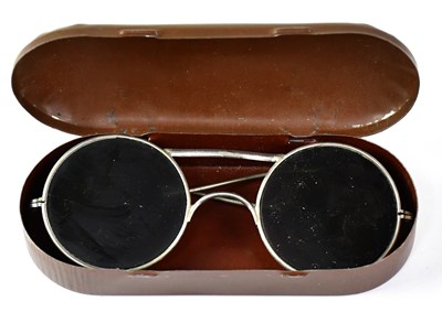 Lot 466 - A pair of tinted spectacles, metal framed with...