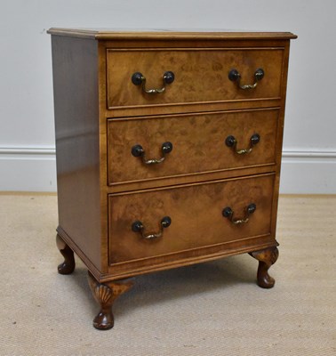 Lot 1115 - A reproduction walnut three drawer chest,...