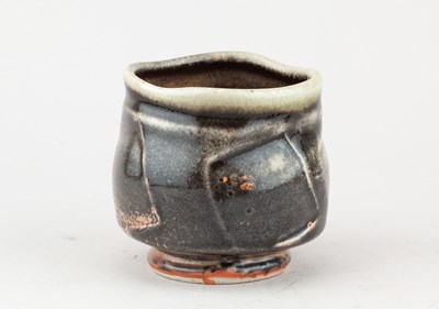 Lot 233 - JACK TROY (born 1938); a faceted porcelain...