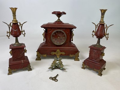Lot 528 - A late 19th century French rouge marble and...